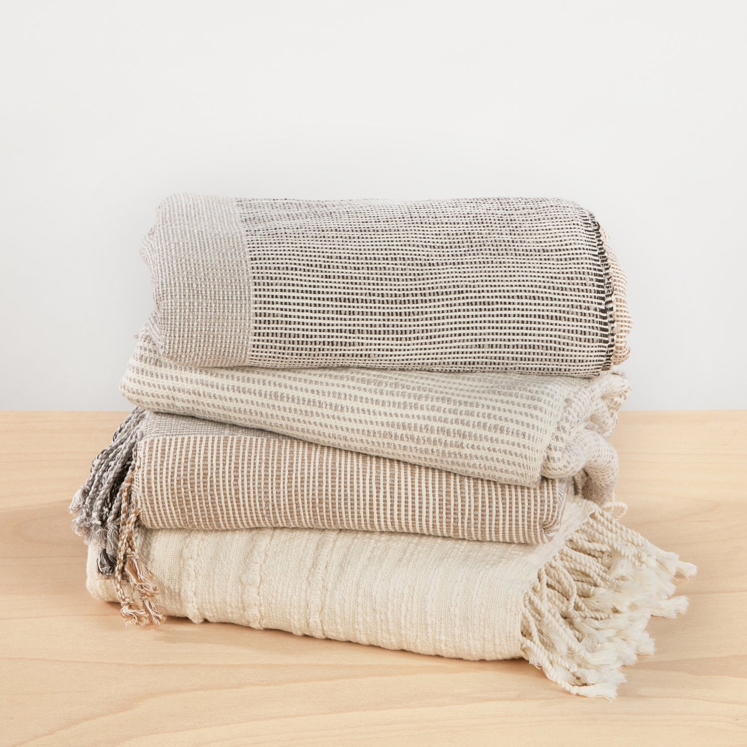 Hand-woven cotton blankets in a stack - By Native